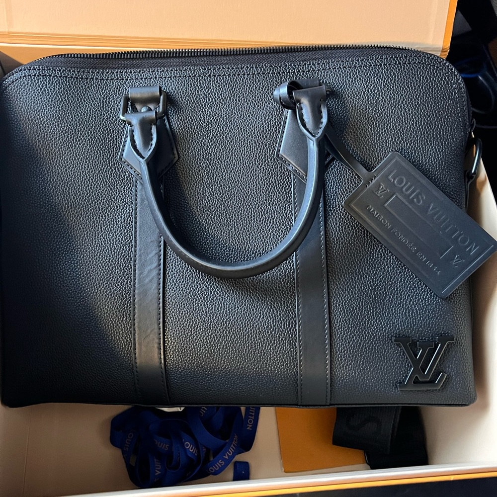 I am selling a Louis Vuitton Takeoff Briefcase that has never been used.